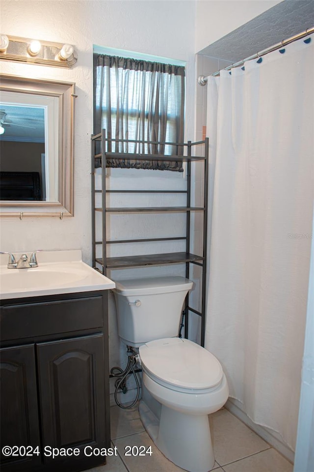 bathroom featuring vanity, toilet, and tile patterned floors