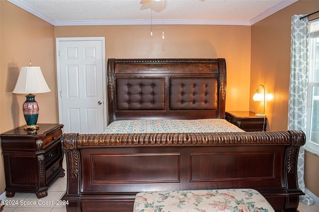 tiled bedroom featuring ceiling fan, crown molding, and a textured ceiling