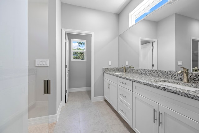 bathroom with vanity and tile patterned flooring