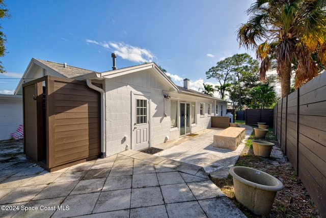 back of property with a patio