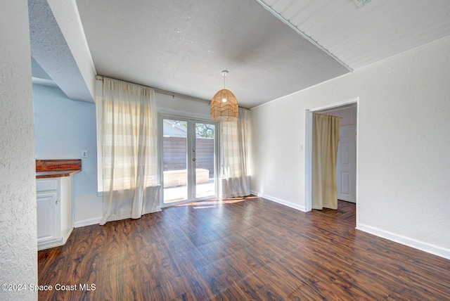 unfurnished living room with dark hardwood / wood-style floors