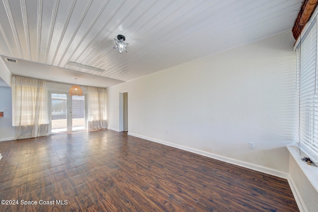 unfurnished room featuring french doors, dark hardwood / wood-style flooring, and wood ceiling