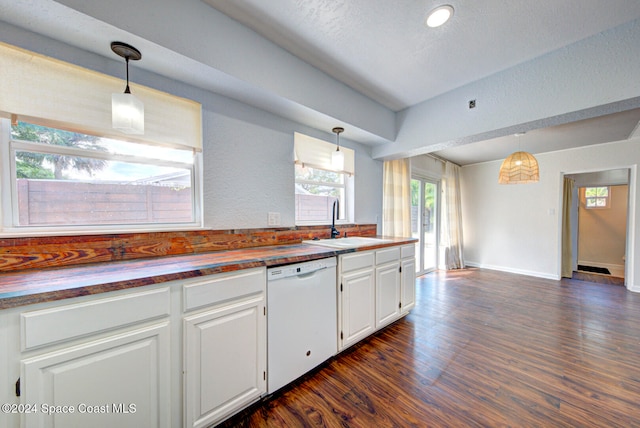 kitchen featuring dishwasher, white cabinetry, and hanging light fixtures