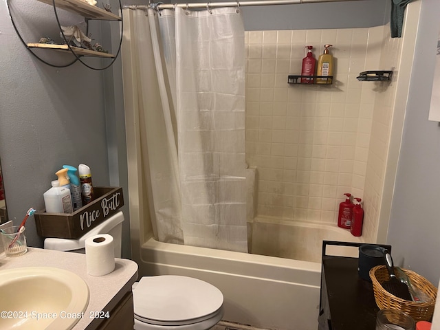 full bathroom with shower / tub combo, vanity, and toilet