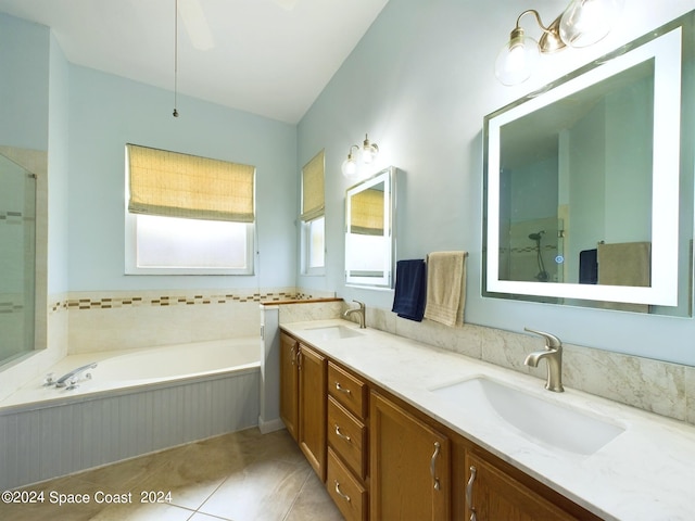 bathroom featuring vanity, plus walk in shower, and tile patterned floors