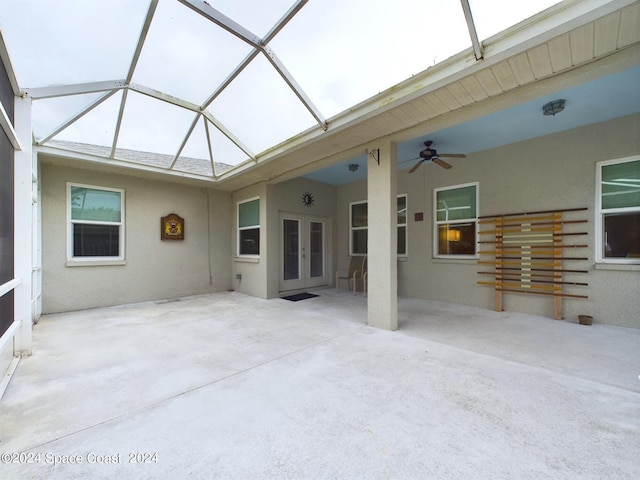 view of patio / terrace featuring ceiling fan and a lanai