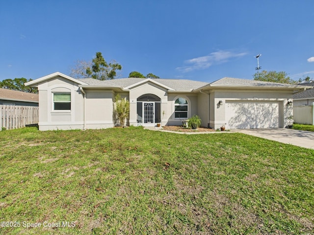 view of front of home with stucco siding, concrete driveway, fence, a garage, and a front lawn