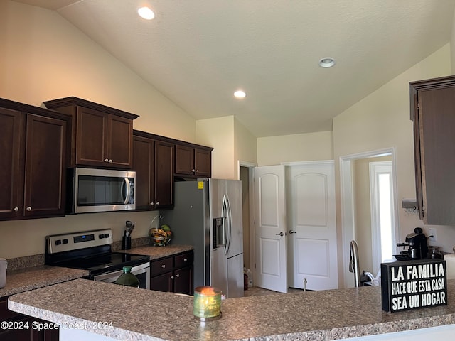 kitchen with a textured ceiling, dark brown cabinets, vaulted ceiling, kitchen peninsula, and appliances with stainless steel finishes