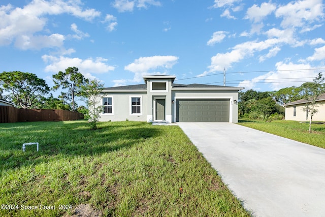 view of front facade featuring a garage and a front lawn