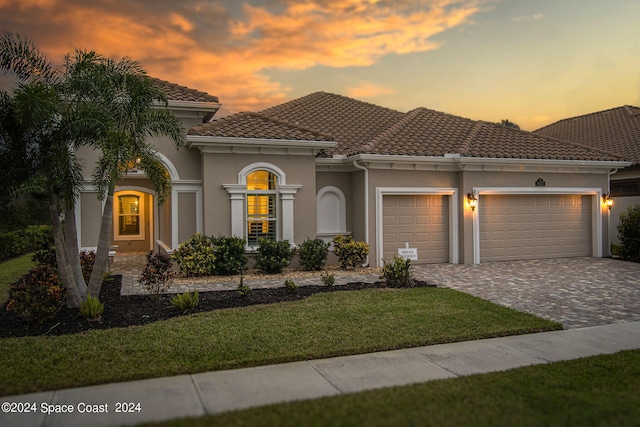 mediterranean / spanish-style home featuring a garage