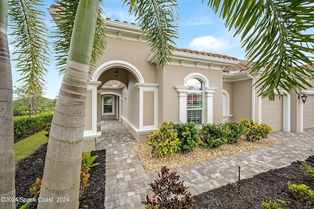 entrance to property featuring a garage