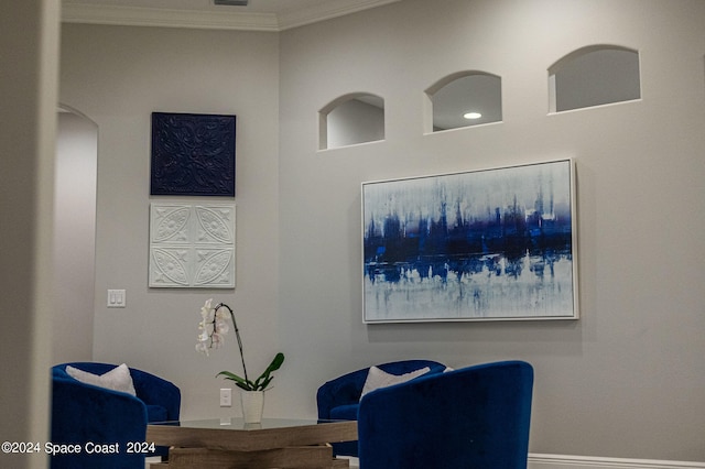 sitting room with crown molding