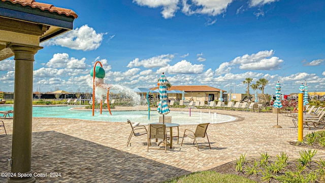 view of swimming pool featuring a patio area and pool water feature