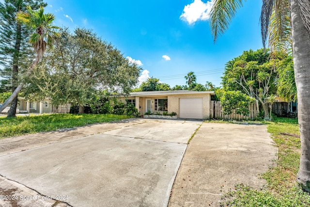 single story home featuring a garage