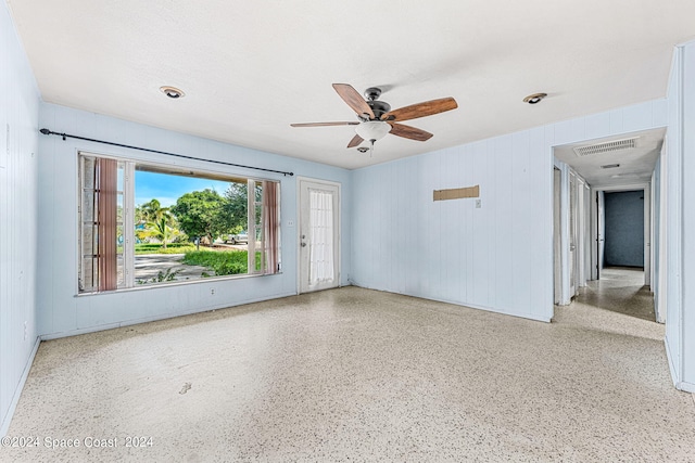 unfurnished room with ceiling fan