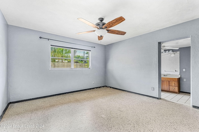 unfurnished room with ceiling fan