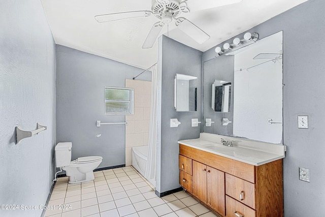 full bathroom featuring tile patterned floors, shower / bath combo with shower curtain, ceiling fan, vanity, and toilet