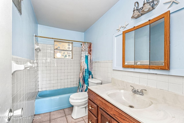 full bathroom featuring tile walls, vanity, shower / tub combo with curtain, toilet, and tile patterned floors