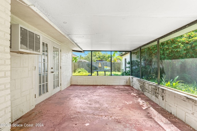 unfurnished sunroom featuring french doors