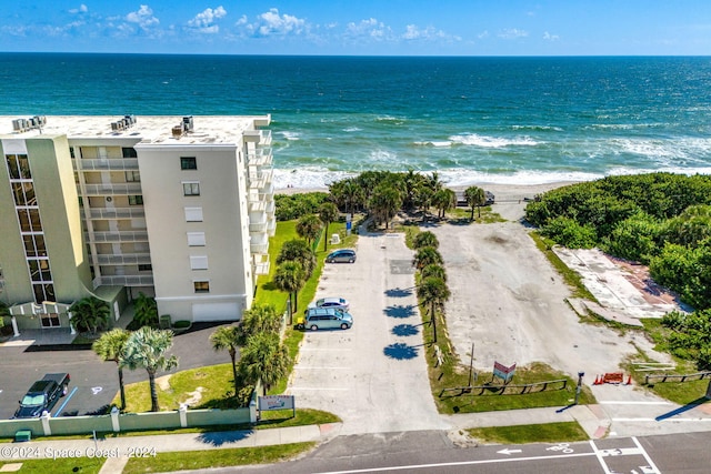 bird's eye view with a view of the beach and a water view