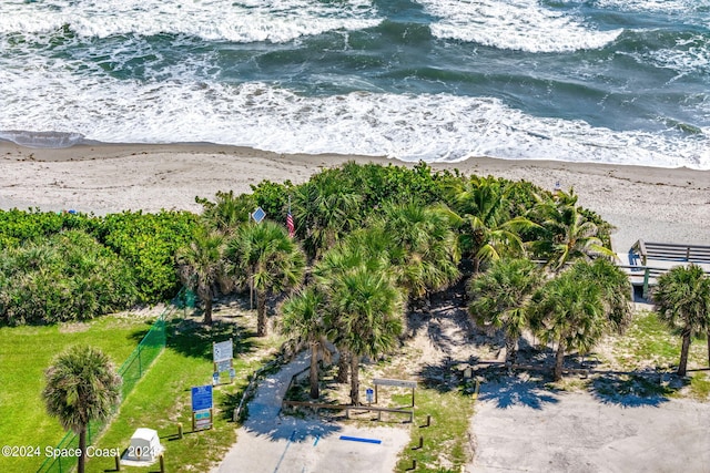 aerial view featuring a water view and a beach view