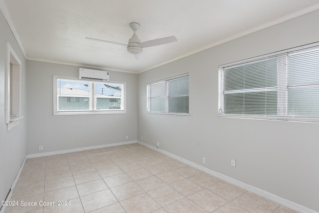 empty room featuring a wall mounted AC, ceiling fan, light tile patterned floors, and crown molding