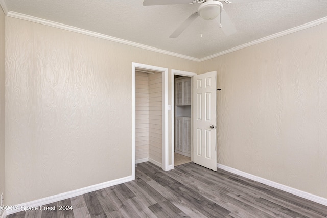 unfurnished bedroom featuring crown molding, dark hardwood / wood-style flooring, a closet, ceiling fan, and a textured ceiling