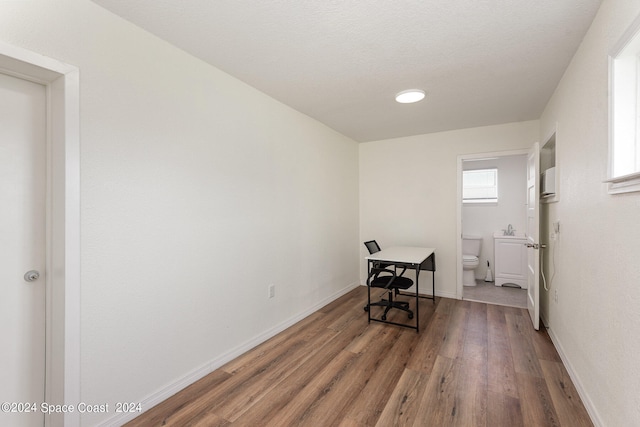 office area featuring a textured ceiling and hardwood / wood-style floors