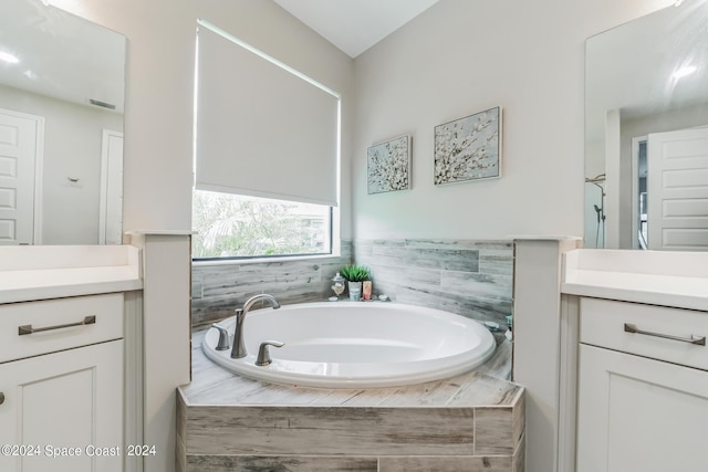 7356 Millbrook Ave, Melbourne, FL 32940 - full bathroom with a garden tub, visible vents, and vanity