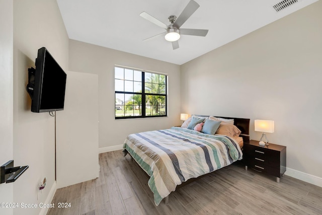7356 Millbrook Ave, Melbourne, FL 32940 - bedroom featuring ceiling fan, light wood-style flooring, baseboards, and visible vents