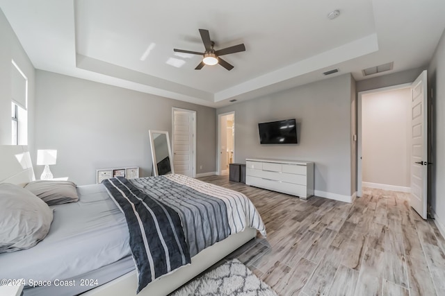 7356 Millbrook Ave, Melbourne, FL 32940 - bedroom featuring baseboards, a raised ceiling, and visible vents