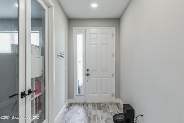 7356 Millbrook Ave, Melbourne, FL 32940 - foyer featuring baseboards and light wood-type flooring