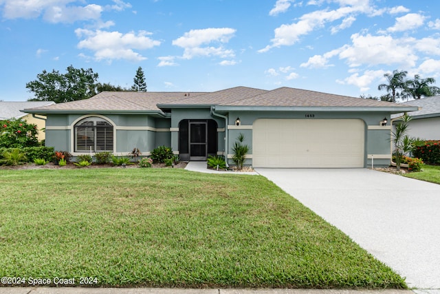 ranch-style home with a garage and a front yard