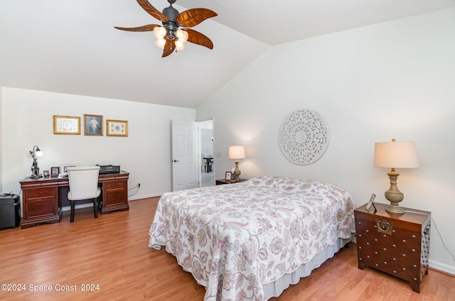 bedroom featuring hardwood / wood-style flooring, vaulted ceiling, and ceiling fan