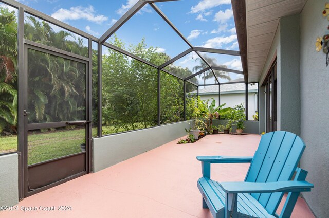 view of patio / terrace featuring glass enclosure