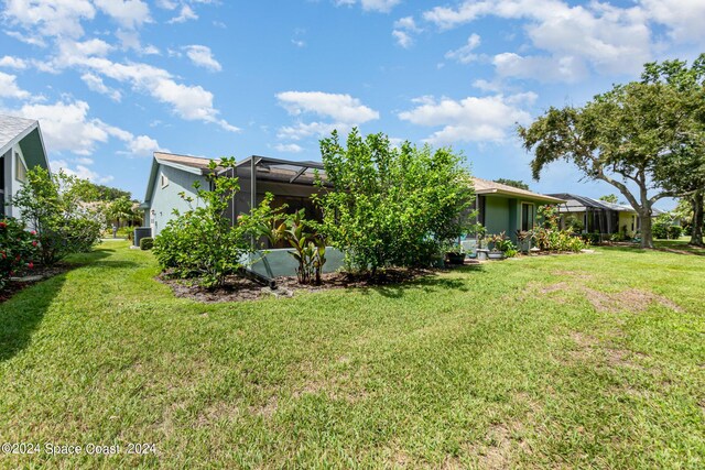 view of yard with a lanai