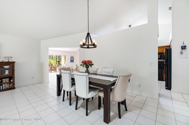 dining room featuring an inviting chandelier and light tile patterned floors