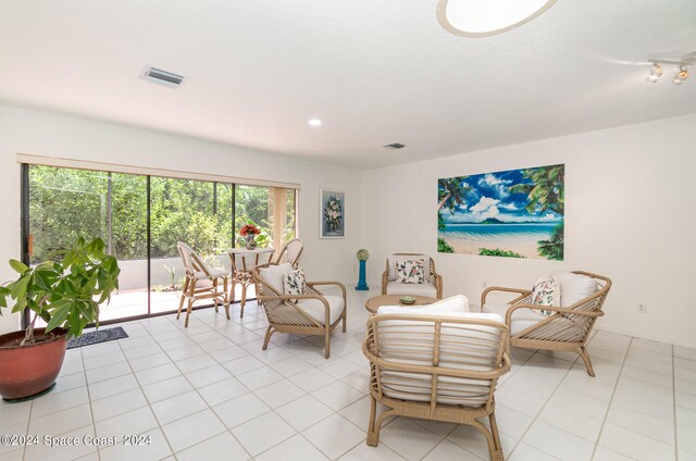 living area with light tile patterned floors