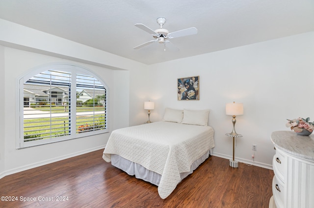 bedroom featuring dark hardwood / wood-style flooring and ceiling fan