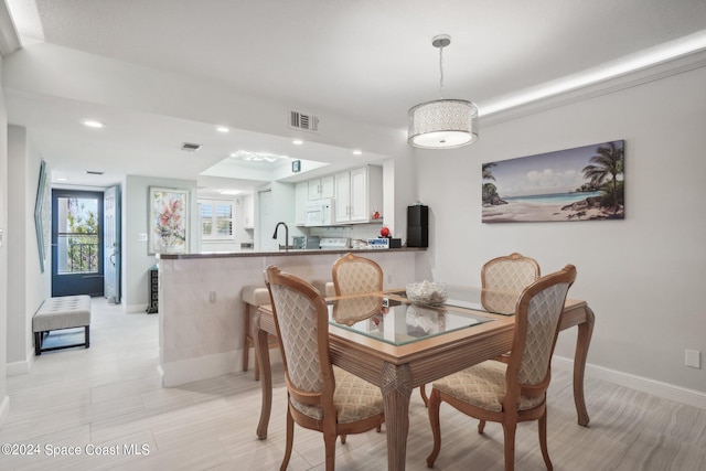 dining space featuring sink