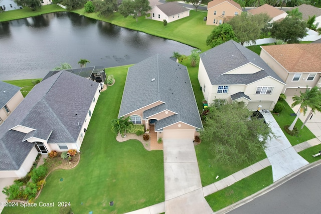 drone / aerial view with a water view