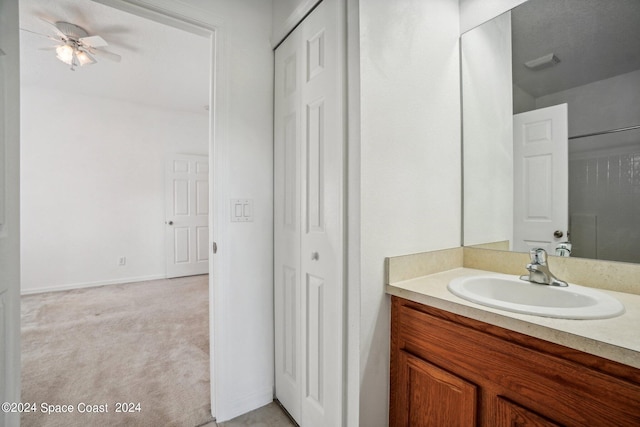 bathroom with ceiling fan and vanity