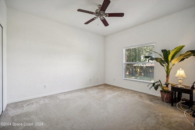 interior space with carpet and ceiling fan