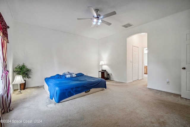 bedroom featuring light carpet and ceiling fan