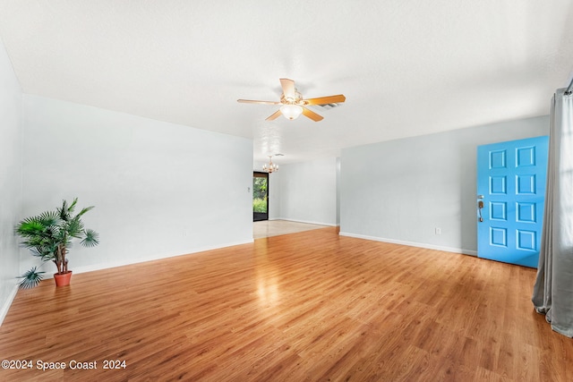 empty room featuring light wood-type flooring and ceiling fan