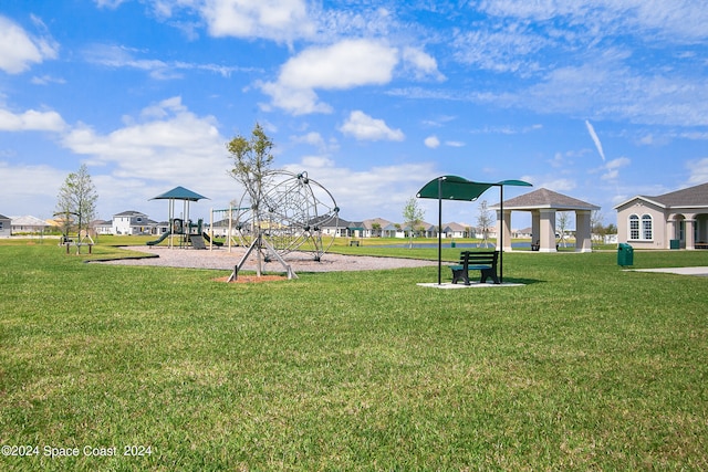 exterior space with a playground and a gazebo