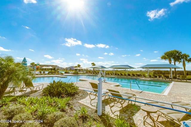 view of swimming pool with a patio area