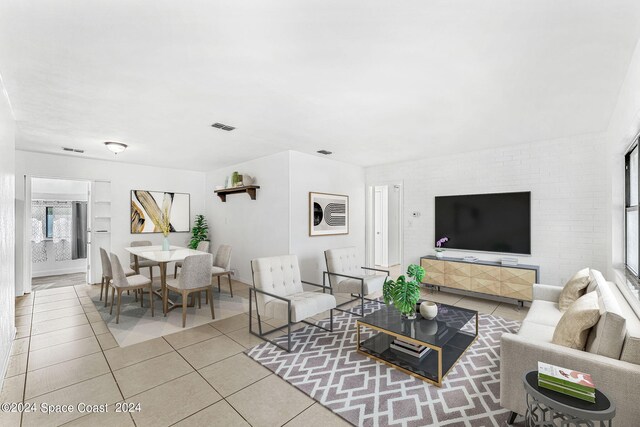 living room with light tile patterned flooring and a healthy amount of sunlight