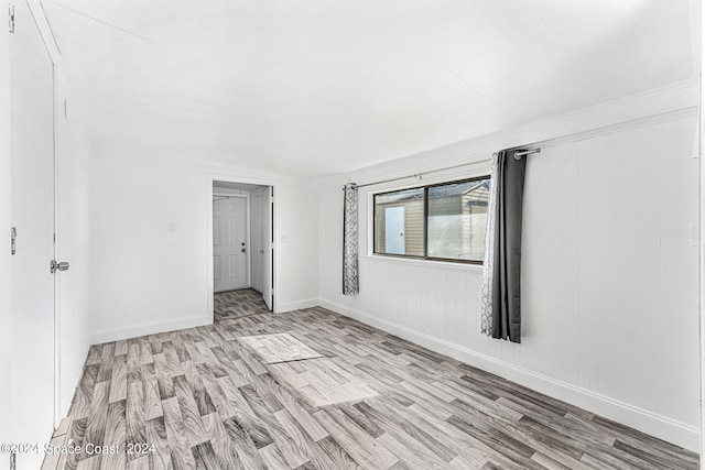 unfurnished bedroom with light wood-type flooring