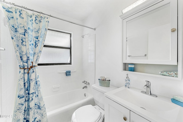 full bathroom with shower / bath combo with shower curtain, toilet, and vanity